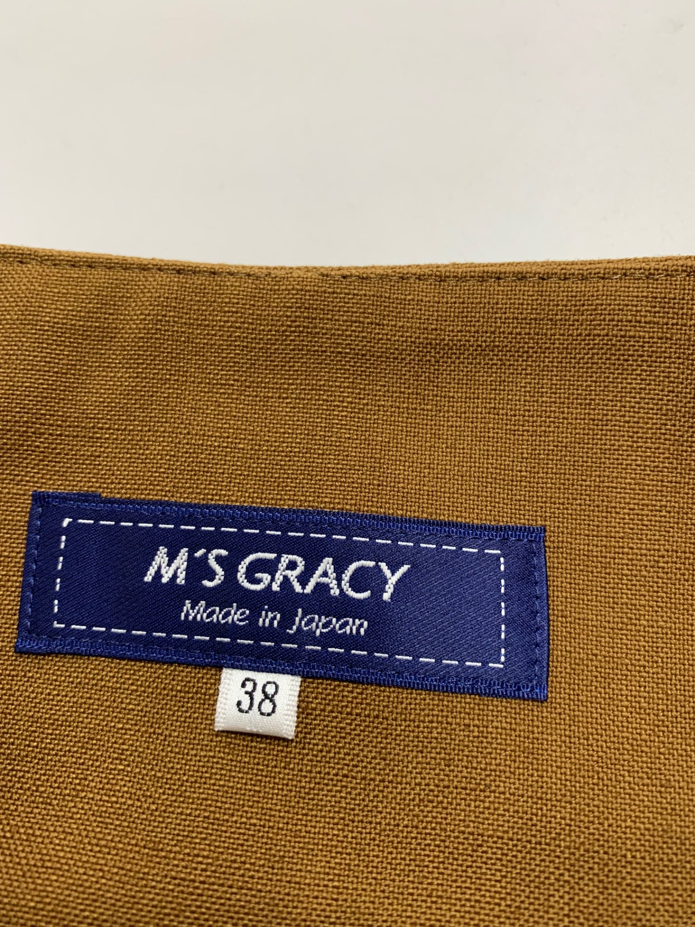 エムズグレイシー 花ボタン付きフレアー 517325 スカート 38 ブラウン ITLRVQKYDU90