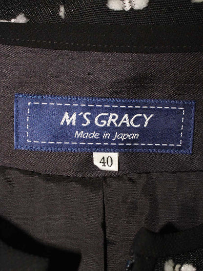 エムズグレイシー 814512 ジャケット 40 ブラック カメリアジップ リボンモチーフ ノーカラー ITDFRV0J55AG