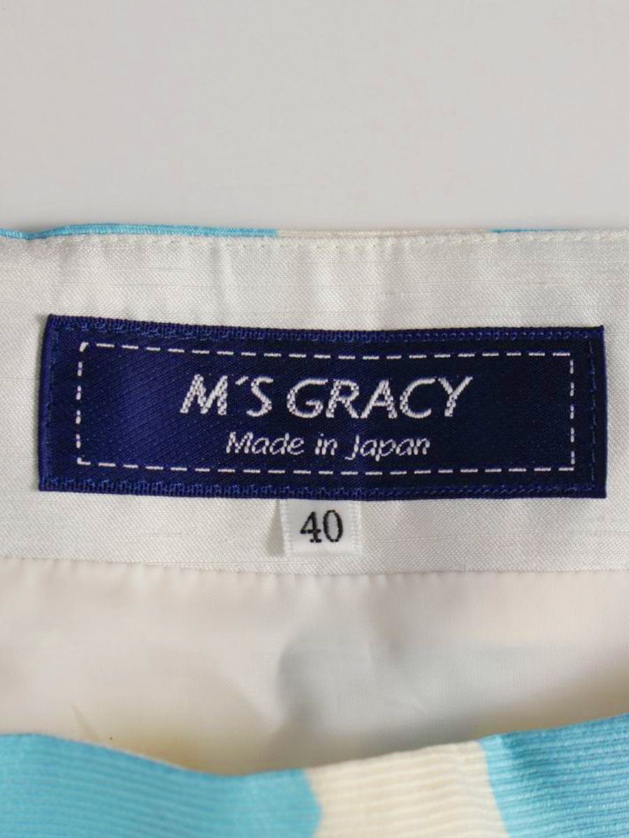 エムズグレイシー 017133 スカート 40 ホワイト/マルチカラー ペイント風 フラワーモチーフ ITCODY3VG363