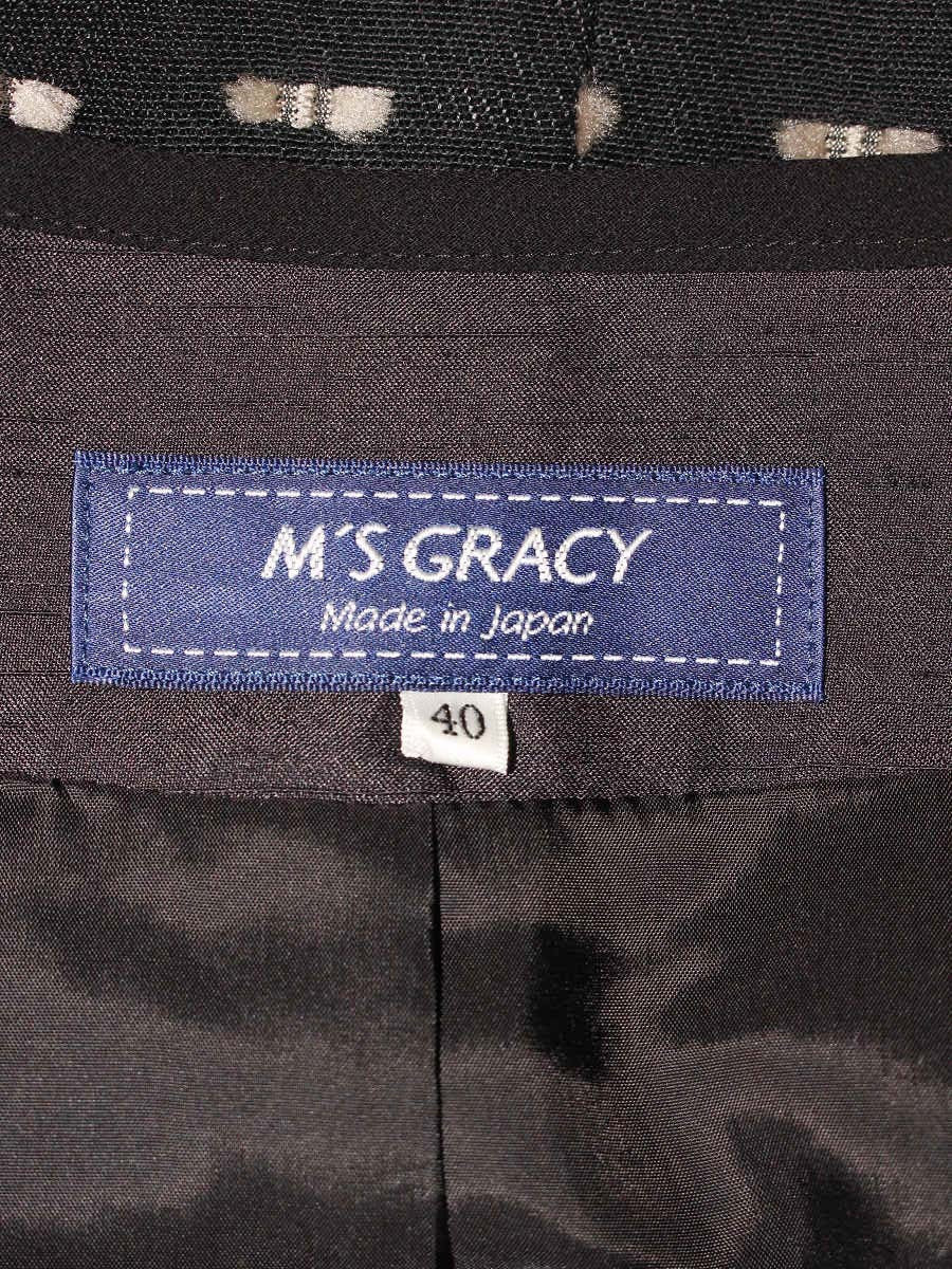 エムズグレイシー 814512 ジャケット 40 ブラック カメリアジップ リボンモチーフ ノーカラー ITAXES7X6WP4