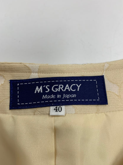 エムズグレイシー 414105 ジャケット 40 ベージュ ノーカラー カメリアジップ リボン ITB0TZ8Z7P3K