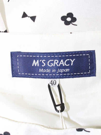 エムズグレイシー 417101 スカート 40 ホワイト フラワー リボンモチーフ タックフレア ITJGZN4NYHCS